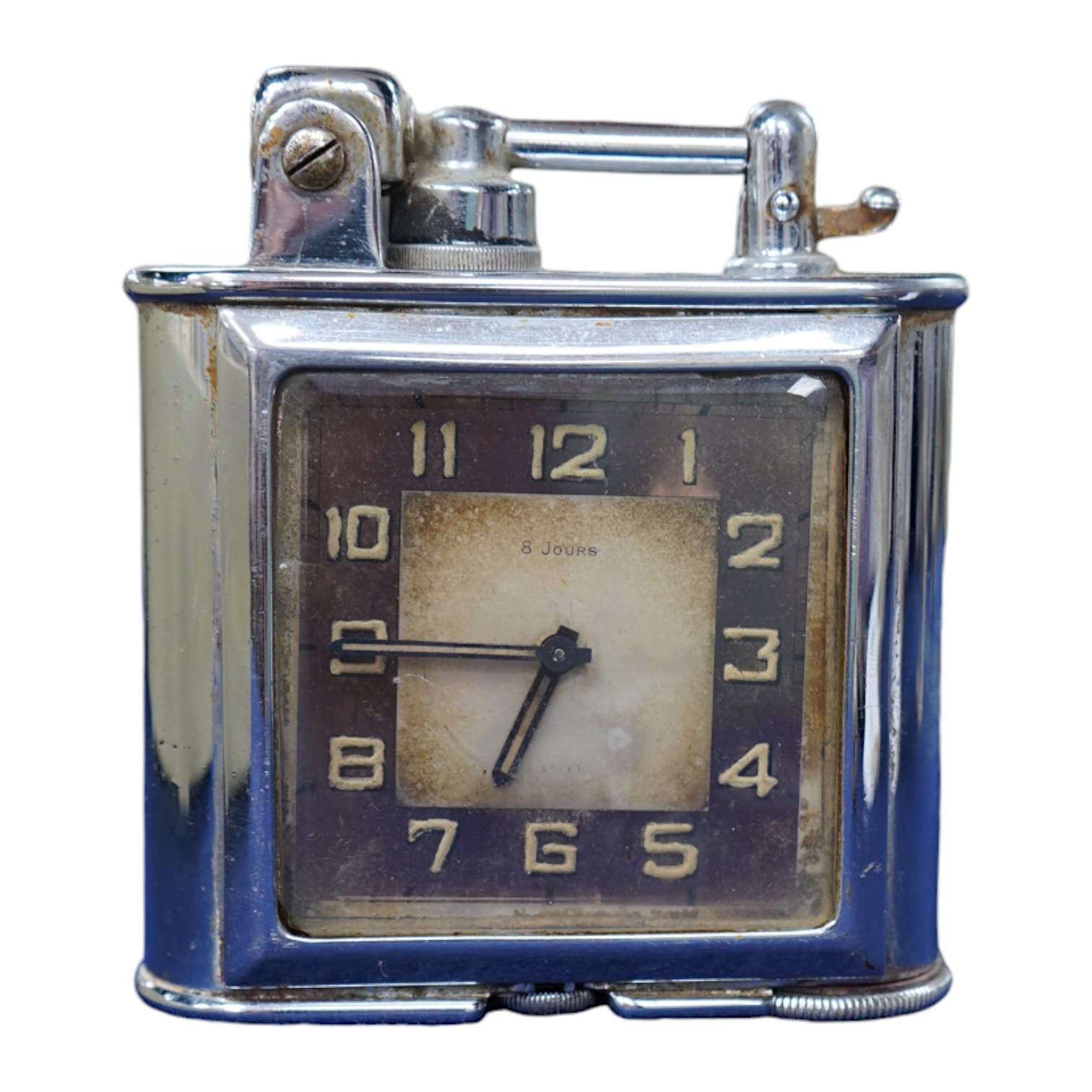 A Lancel Automatique table lighter incorporating an eight day timepiece, 9.5cm high. Condition - fair, some discolouration to the dial.